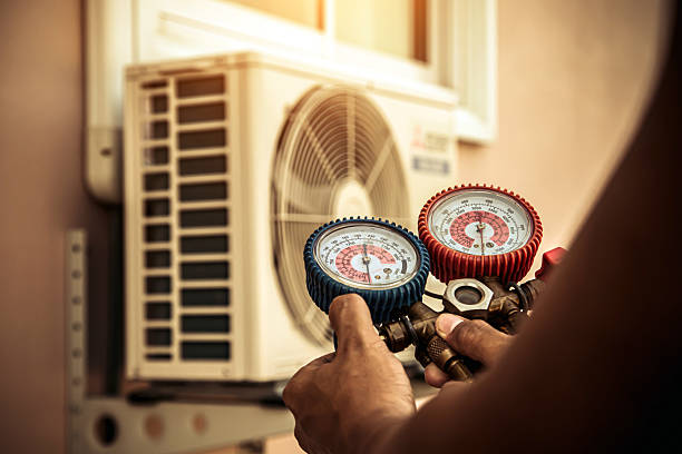 Professional Air Conditioning Service technician working in Eldon, MO